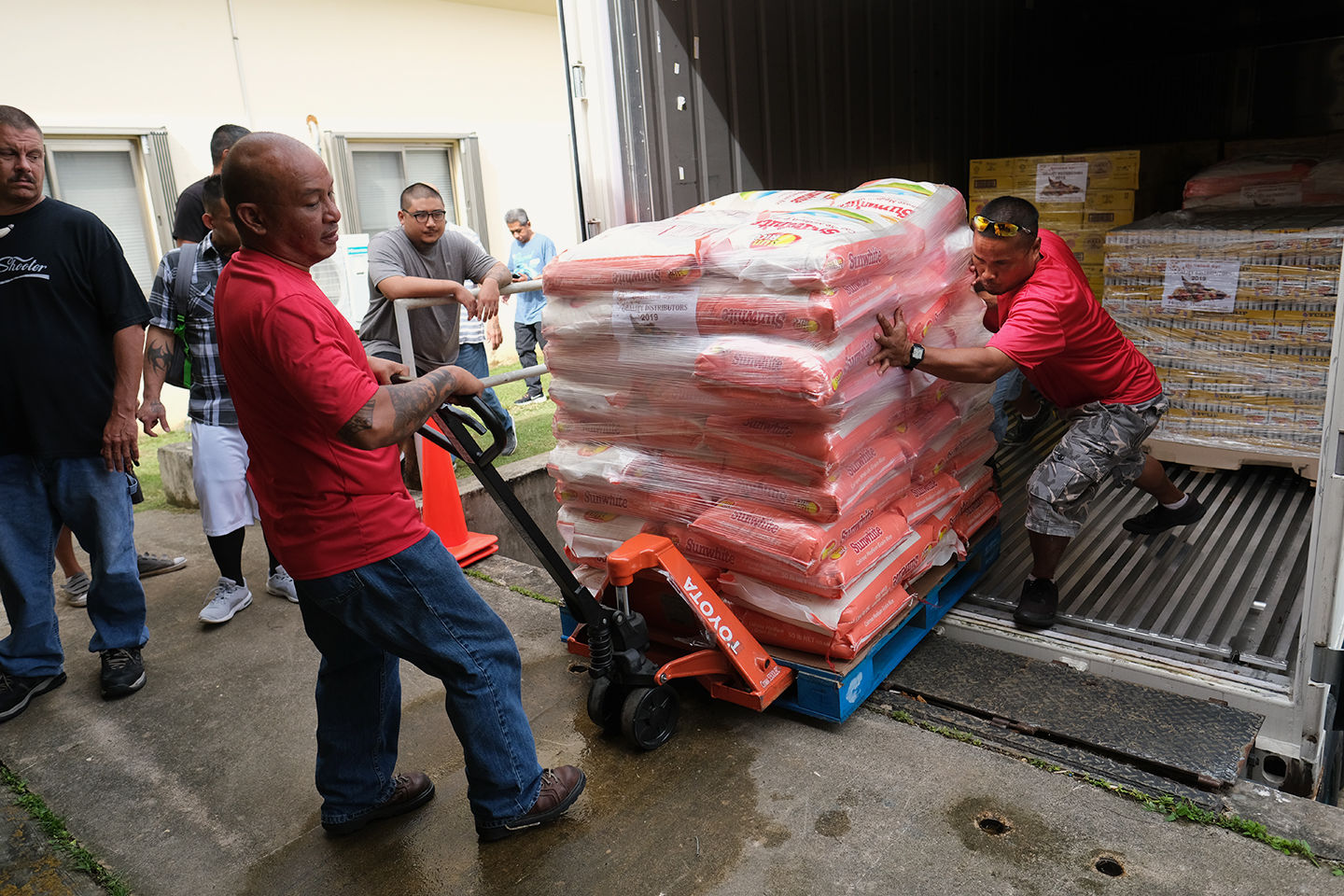 Quality Distributers makes deposit into food bank